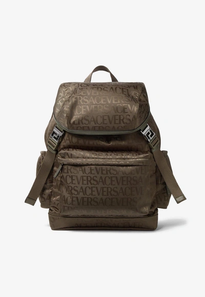 Shop Versace All-over Logo Jacquard Backpack In Brown