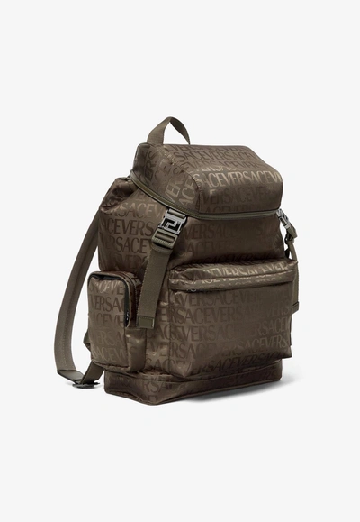 Shop Versace All-over Logo Jacquard Backpack In Brown
