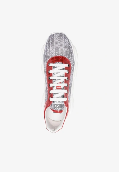 Shop Moschino All-over Logo Low-top Sneakers In Multicolor