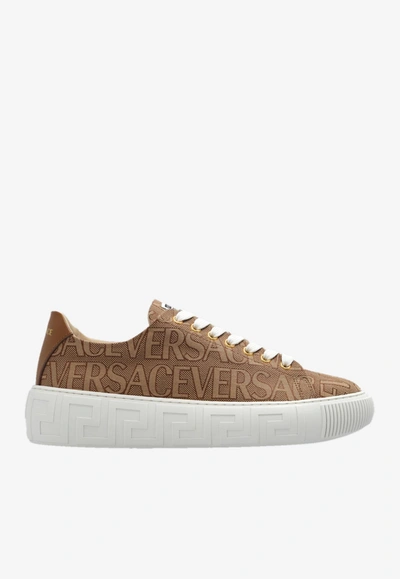 Shop Versace All-over Logo Low-top Sneakers In Brown