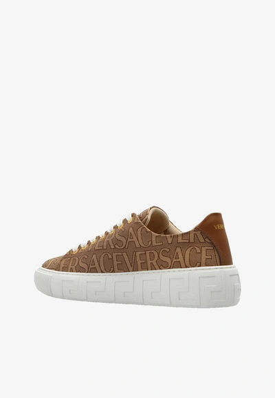 Shop Versace All-over Logo Low-top Sneakers In Brown