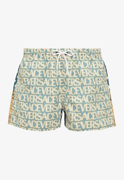 Shop Versace All-over Logo Polka Dot Swim Shorts In Multicolor