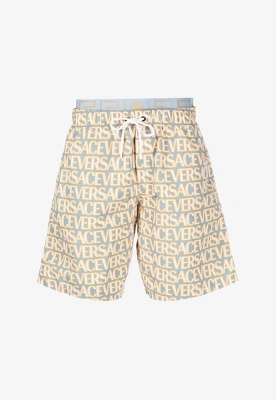 Shop Versace All-over Logo Print Boardshorts In Multicolor