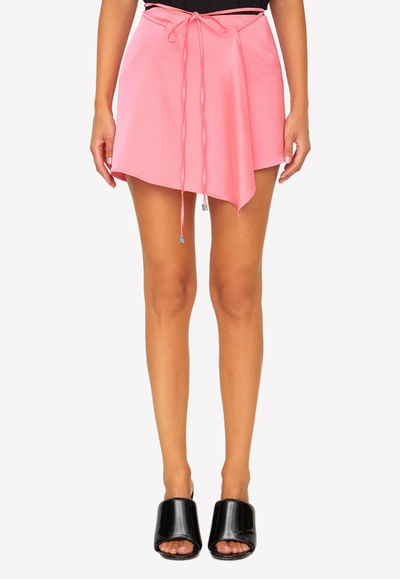 Shop Attico Asymmetric Mini Wrap Skirt In Satin In Pink