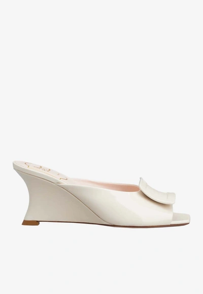 Shop Roger Vivier Belle Vivier 65 Lacquered Buckle Wedge Mules In Patent Leather In Off-white