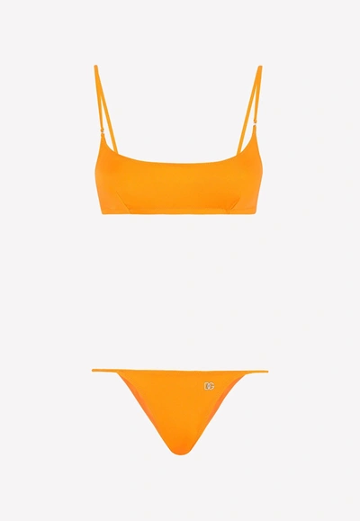 Shop Dolce & Gabbana Bralette Bikini With Metal Logo In Orange