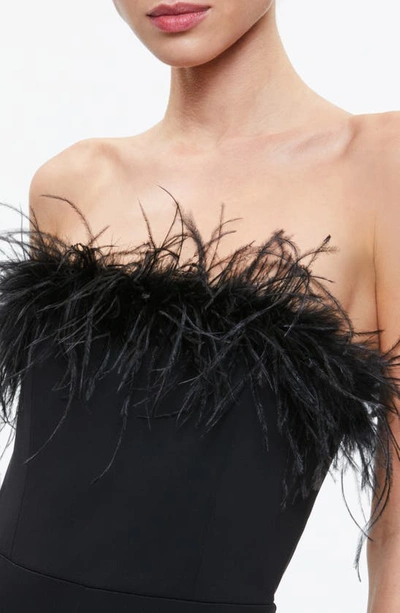 Shop Alice And Olivia Idell Strapless Feather Trim Jumpsuit In Black