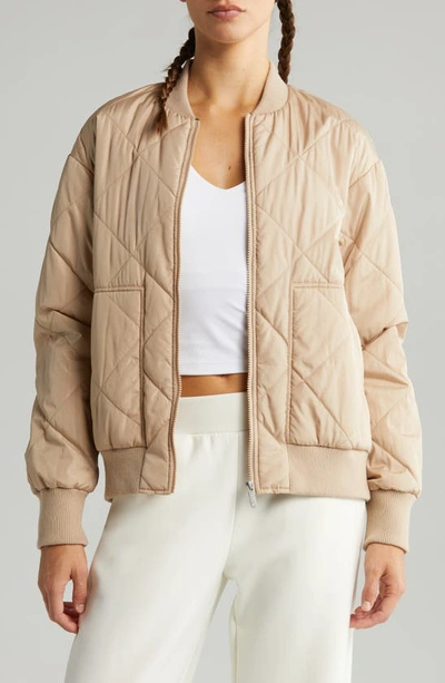 Shop Zella Quilted Side Zip Bomber Jacket In Tan Taupe