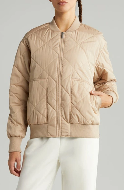 Shop Zella Quilted Side Zip Bomber Jacket In Tan Taupe