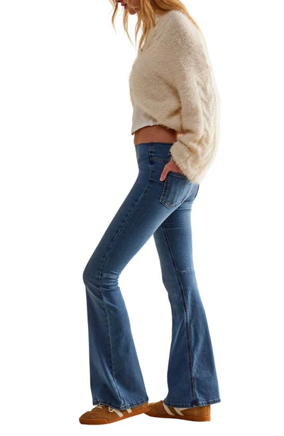 Shop Free People Penny Pull-on Flare Jeans In Blue Sea