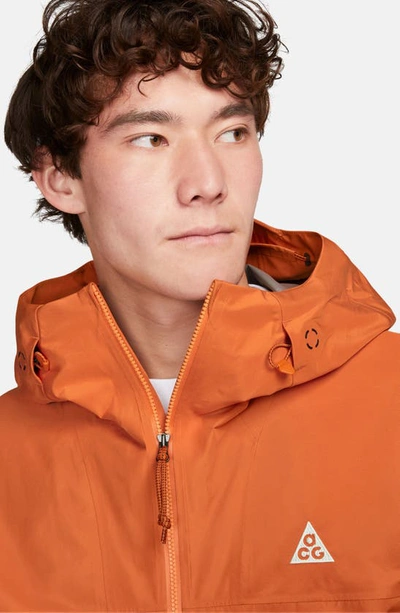 Shop Nike Storm-fit Adv Acg Chain Of Craters Jacket In Campfire Orange/ Summit White