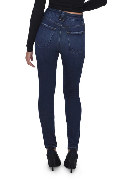 Shop Good American Good Waist Exposed Button Frayed Skinny Jeans In Indigo566