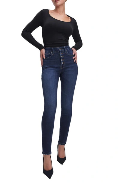 Shop Good American Good Waist Exposed Button Frayed Skinny Jeans In Indigo566