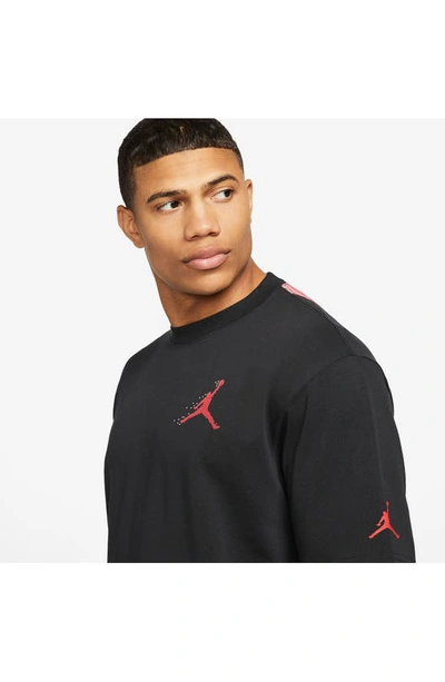 Shop Jordan Essentials Holiday Graphic T-shirt In Black