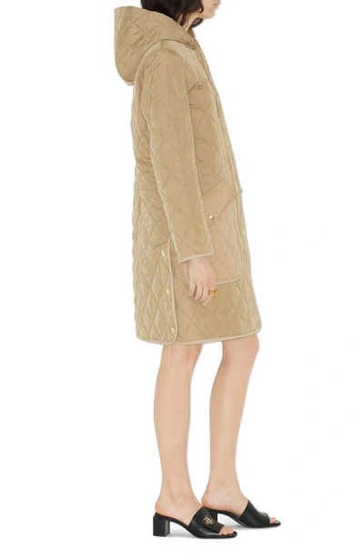 Shop Burberry Roxby Quilted Hooded Long Jacket In Archive Beige