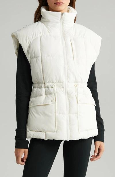 Shop Zella Adjustable Drawcord Waist Puffer Vest In Ivory Egret