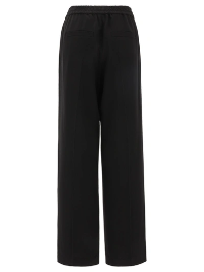 Shop Brunello Cucinelli Wide Trousers With Elasticated Waist