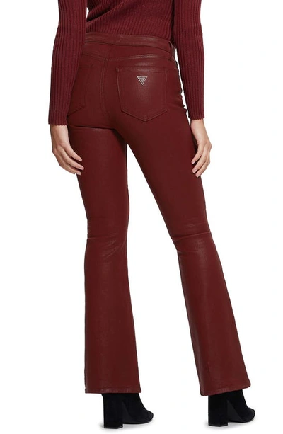 Shop Guess Sexy Coated Flare Jeans In Red