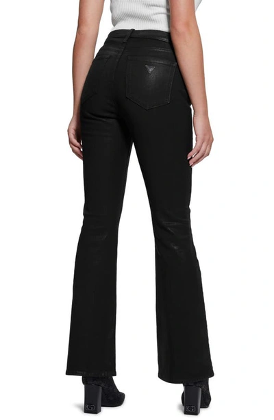 Shop Guess Sexy Coated Flare Jeans In Jet Black Multi