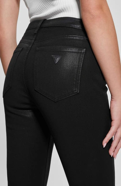 Shop Guess Sexy Coated Flare Jeans In Jet Black Multi