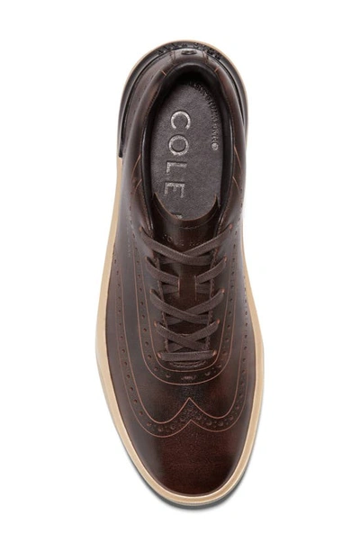 Shop Cole Haan Grandpro Crew Wing Tip Sneaker In Ch Dark Chocolate Brush
