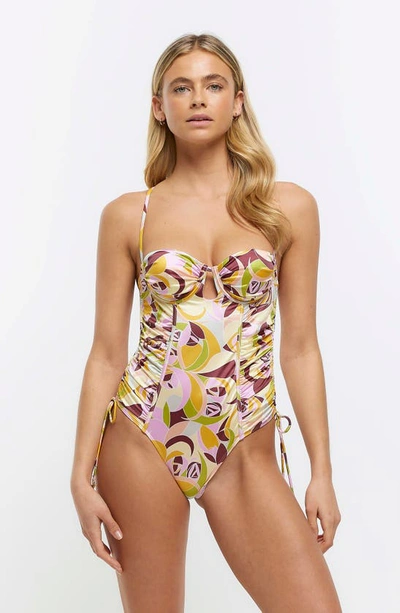 Shop River Island Ruched Balconette Underwire One-piece Swimsuit In Pink