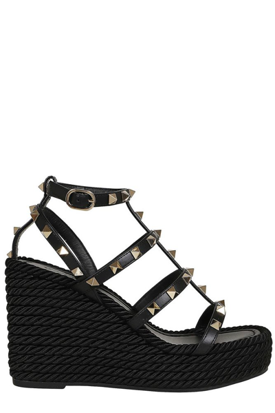 Shop Valentino Garavani Rockstud Wedge Sandals In Black