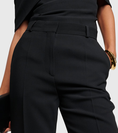 Totême High-rise Pleated Crêpe Flared Pants In Black