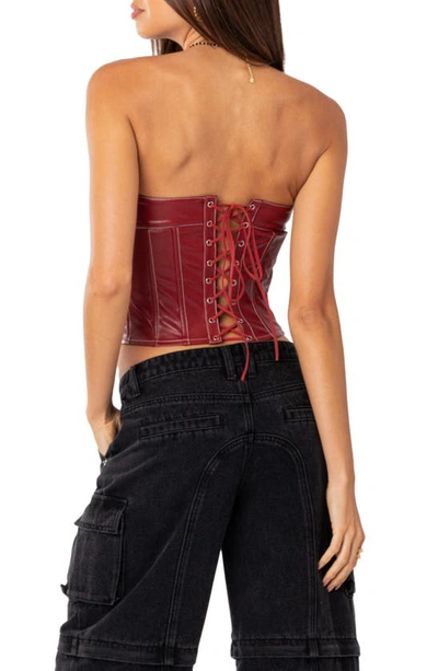 Shop Edikted Moss Lace-up Strapless Faux Leather Corset Top In Burgundy