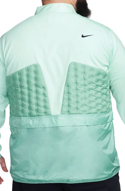 Shop Nike Therma-fit Adv Repel Water Repellent Half Zip Golf Jacket In Jade Ice/ Mineral/ Black