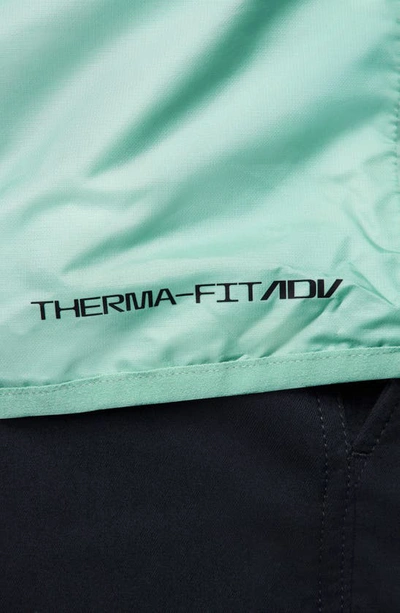 Shop Nike Therma-fit Adv Repel Water Repellent Half Zip Golf Jacket In Jade Ice/ Mineral/ Black