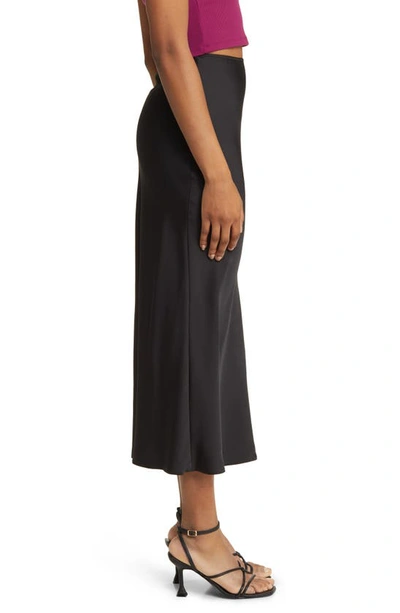 Shop Asos Design Bias Cut Satin Midi Skirt In Black