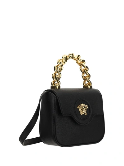 Shop Versace Shoulder Bags In Nero/oro