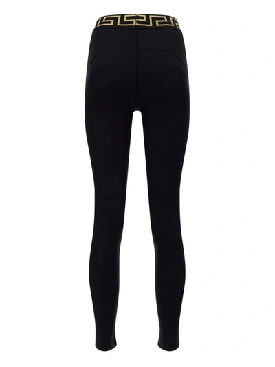 Shop Versace Leggings In Nero