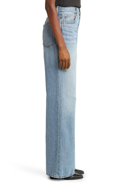 Shop Re/done '70s Ultra High Waist Wide Leg Jeans In Sunfaded Flow