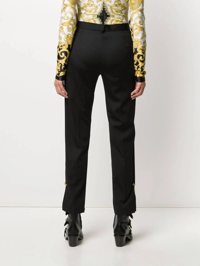 Shop Versace Safety Pin Trousers In Black