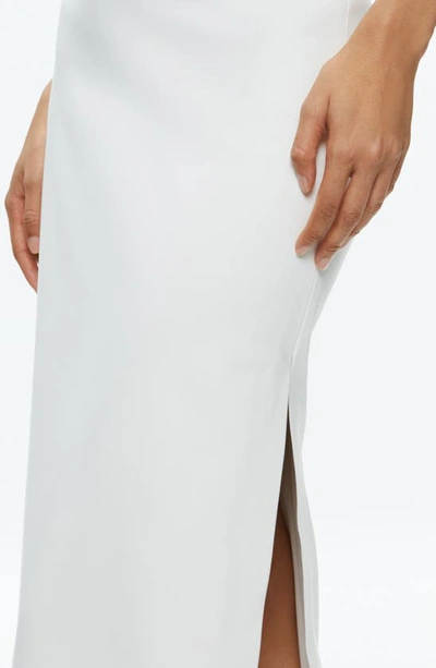 Shop Alice And Olivia Maeve Back Slit Faux Leather Midi Skirt In Off White