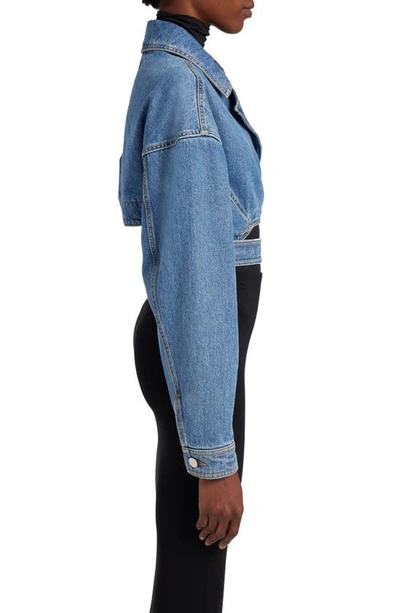 Shop Alaïa Crossover Cutout Crop Denim Wrap Jacket In Bleu Vintage