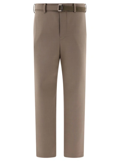 Shop Sacai Belted Trousers In Beige