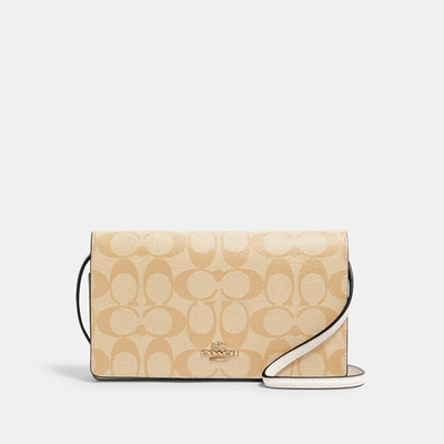 Shop Coach Outlet Anna Foldover Crossbody Clutch In Signature Canvas In Multi