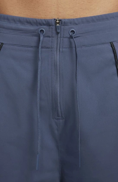 Shop Nike Running Division Water Repellent High Waist Pants In Diffused Blue