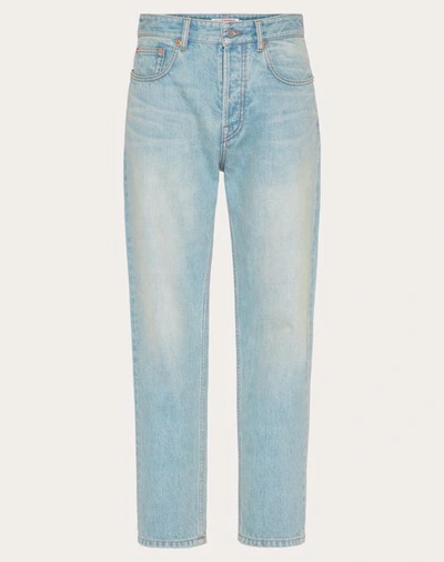 Shop Valentino Denim Trousers With Embossed Vlogo Signature