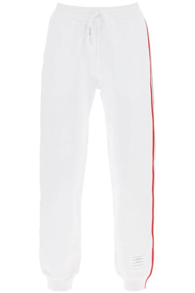 Shop Thom Browne Joggers With Tricolor Bands