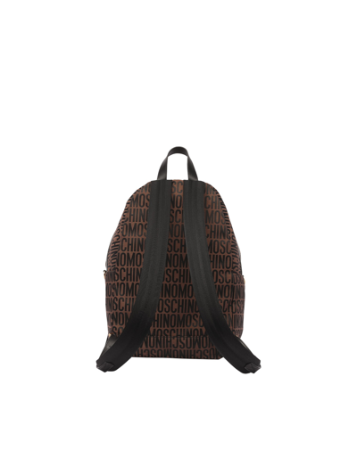 Shop Moschino All Over Logo Backpack In Brown
