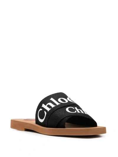 Shop Chloé Woody Flat Sandals In Black