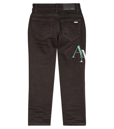 Shop Amiri Distressed Logo Skinny Jeans In Black