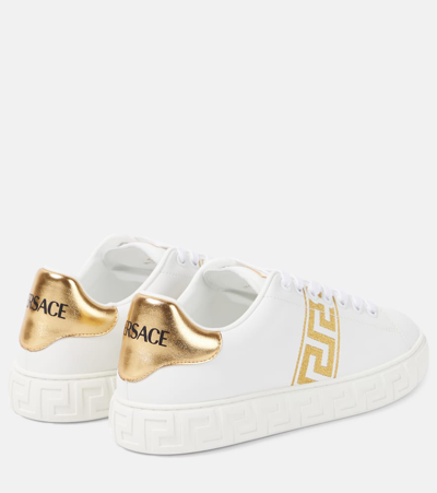 Shop Versace Greca Embroidered Faux Leather Sneakers In White