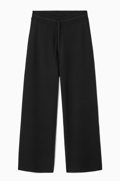 Shop Cos Double-faced Knitted Joggers In Black