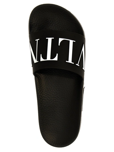 Shop Valentino Vltn Sandals White/black