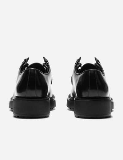 Shop Prada Diapason Opaque Brushed Leather Lace-up Shoes In Black